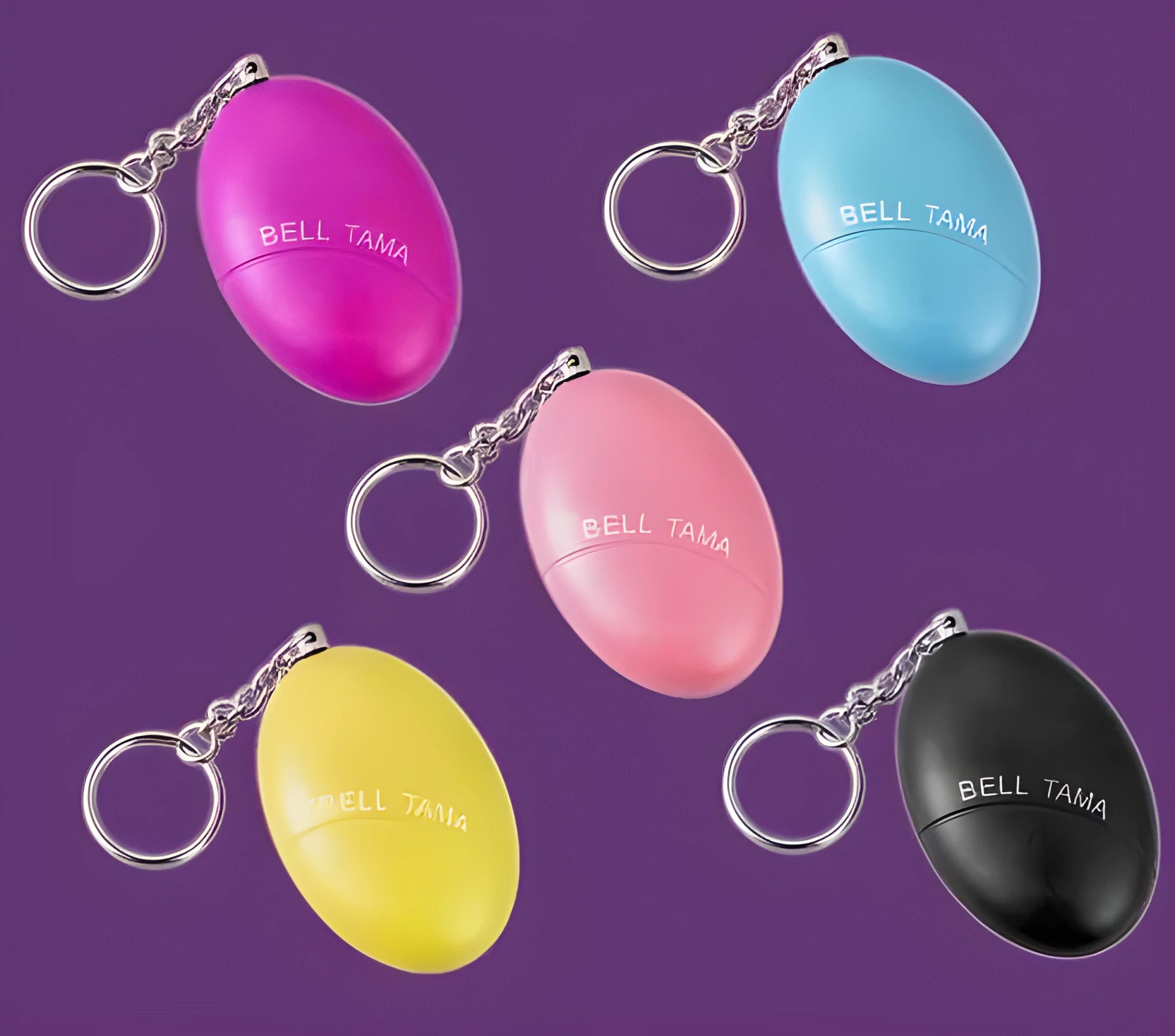 Compact keychain personal alarm in colours like black, blue, or pink showing the pull-out activation tab.