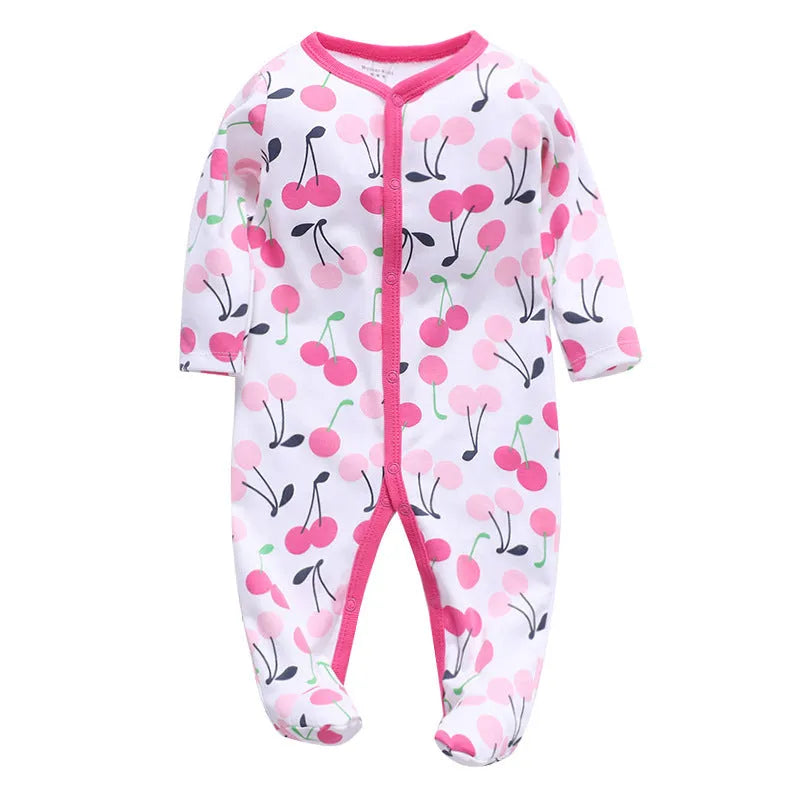 A soft cotton baby one-piece garment featuring a dinosaur print, shown on a hanger.