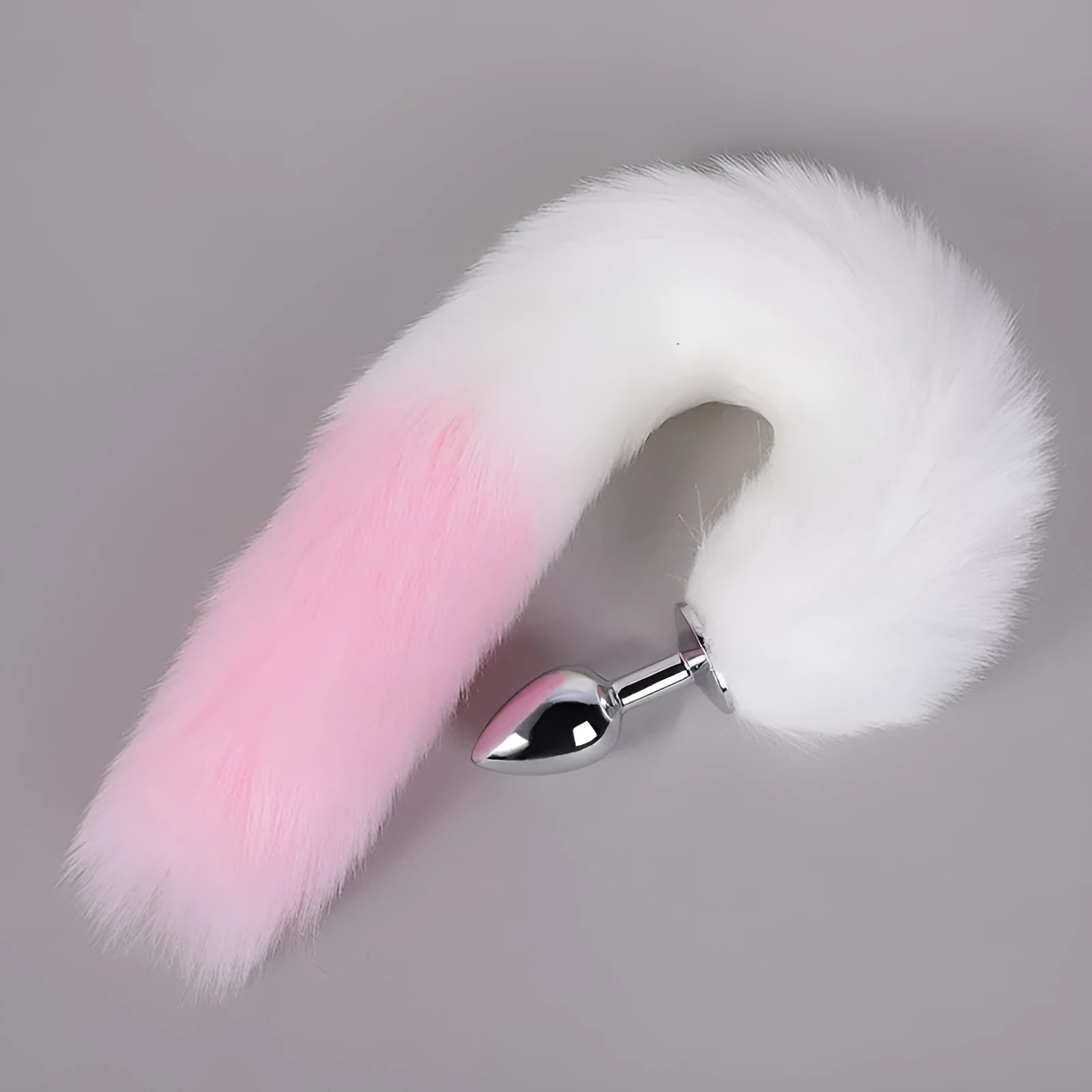 Pink PU leather manual craft adult toy docking plug lying on a light background