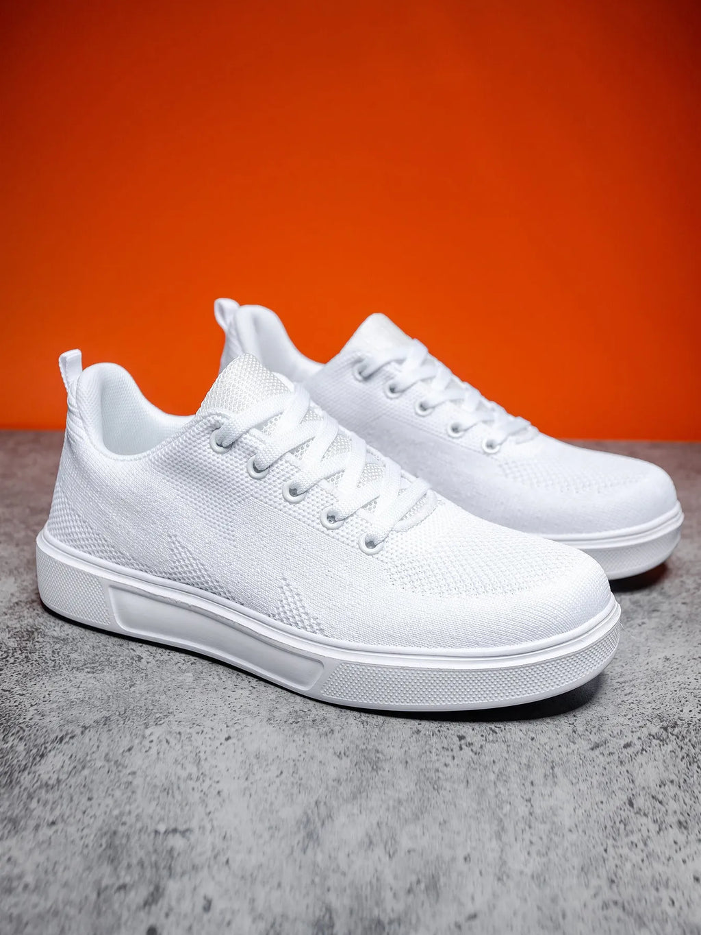 Light white unisex trainers with thick EVA sole and mesh upper in black or white colours