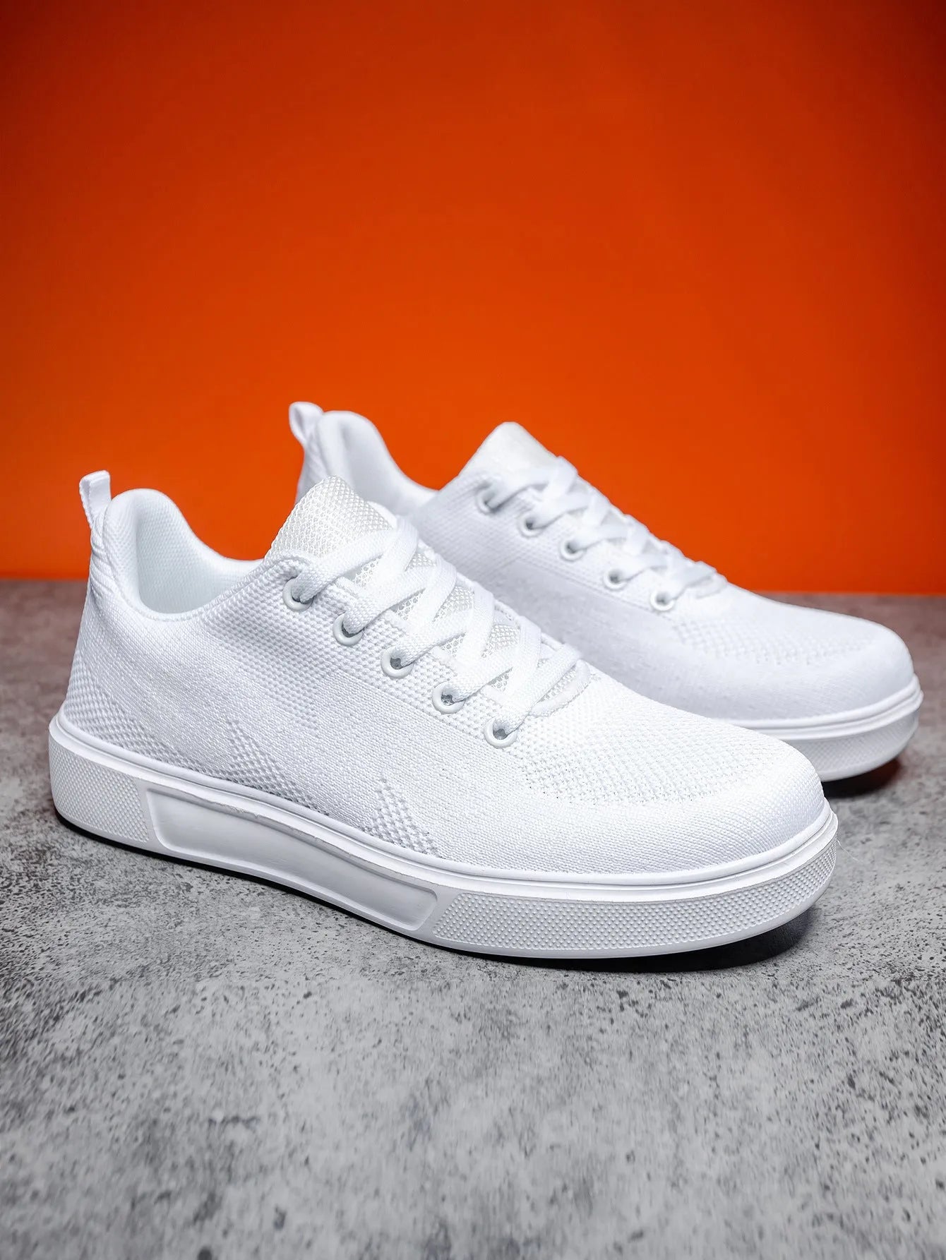 Light white unisex trainers with thick EVA sole and mesh upper in black or white colours