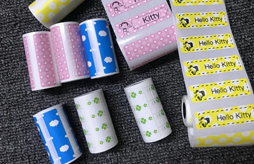 PerPage mini wireless portable thermal printer paper roll in multiple colours, showing label and sticker options