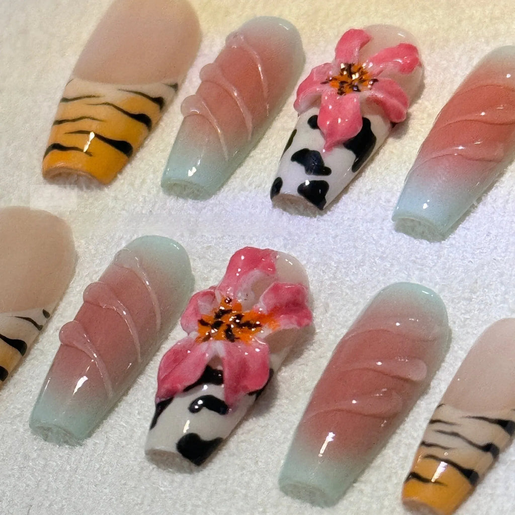 Zebra pattern lily hand carving nail art set showing embossed flower and leopard print designs