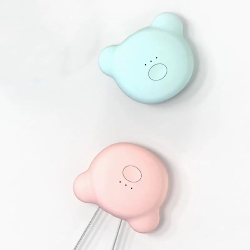 Compact USB-powered air purifier necklace in pink, showing wearable design and one-button control.