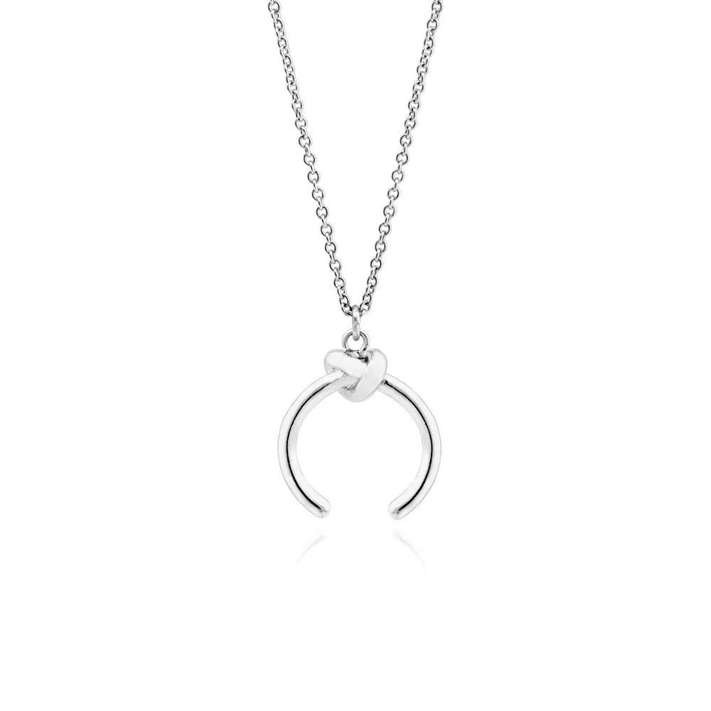 Gold geometric pendant necklace on a cross chain, shown at an adjustable length.