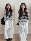 Striped long sleeve relaxed fit T-shirt in black stripes for sun protection, polyester fabric