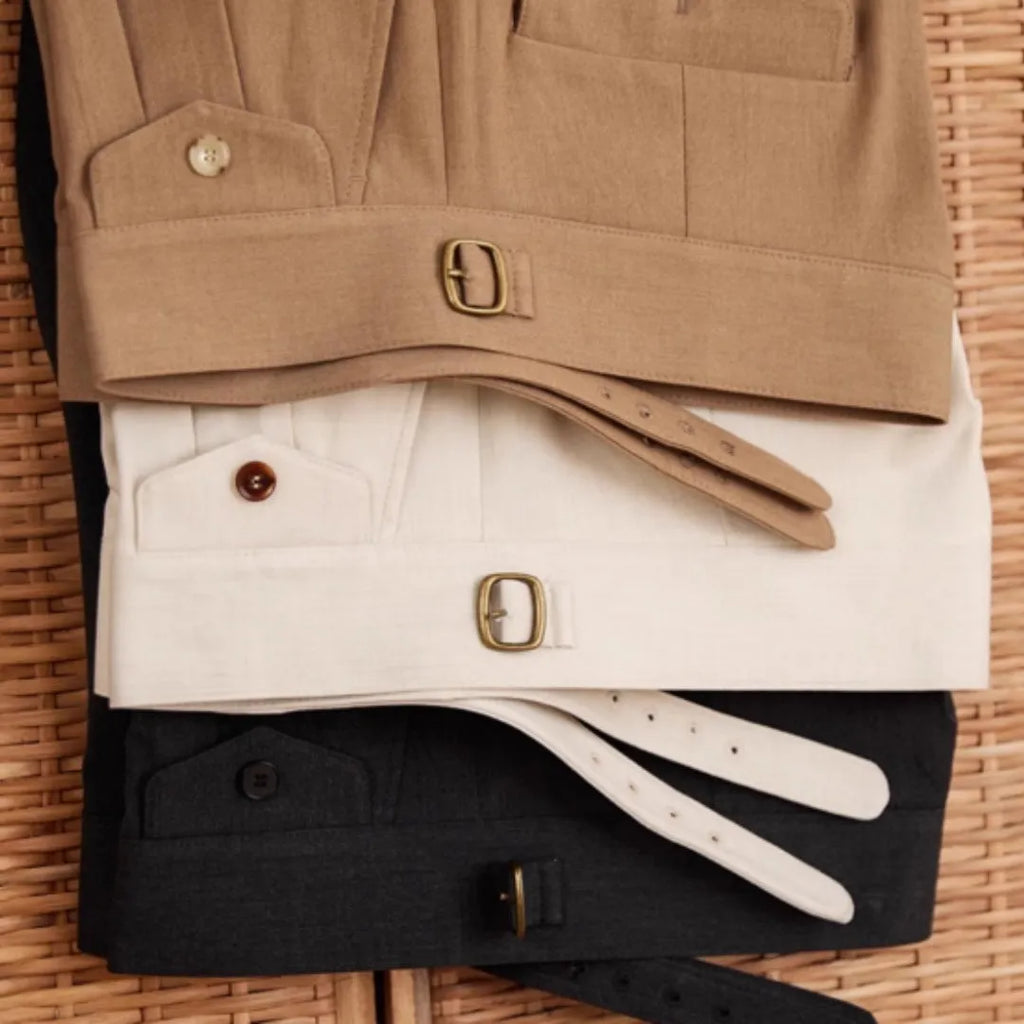 Men's slim fit straight leg business trousers in dark grey, displayed flat.