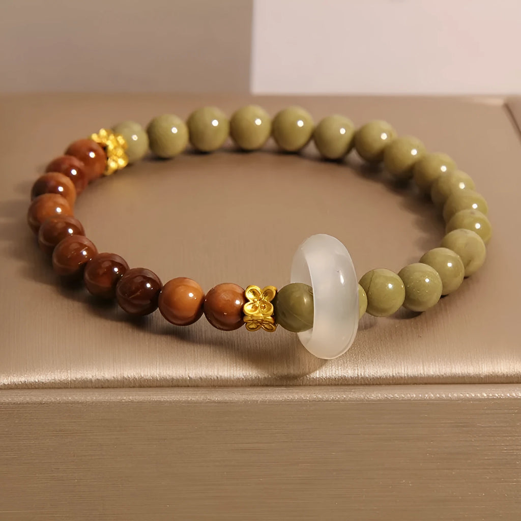 Green gradient women's bracelet with crown and geometric shapes in a Chinese style design