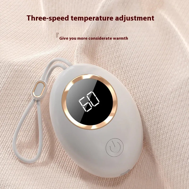 A digital display hand warmer power bank in a choice of colours, showing its USB port.
