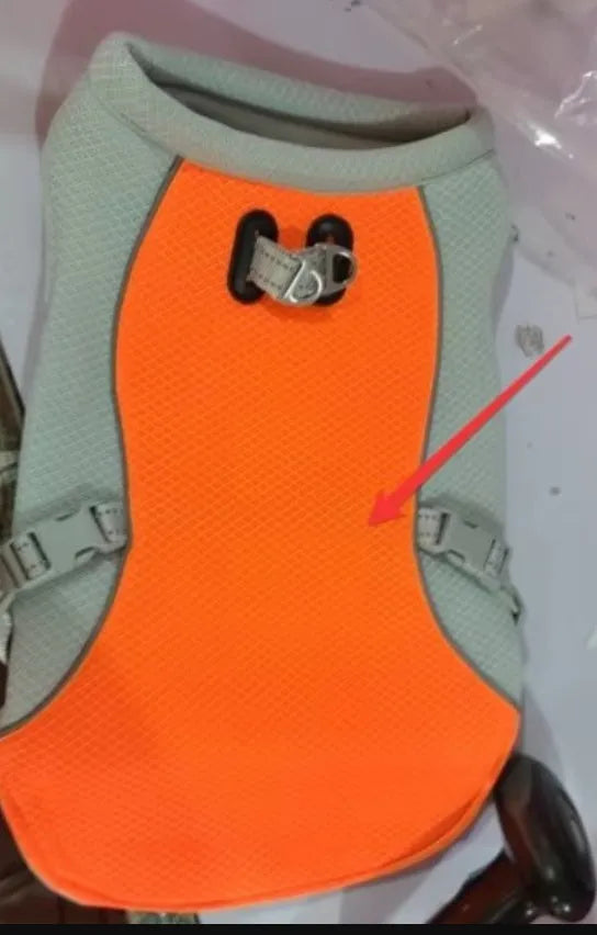 Orange polyester dog cooling vest showing layered construction for summer heat and sun protection.