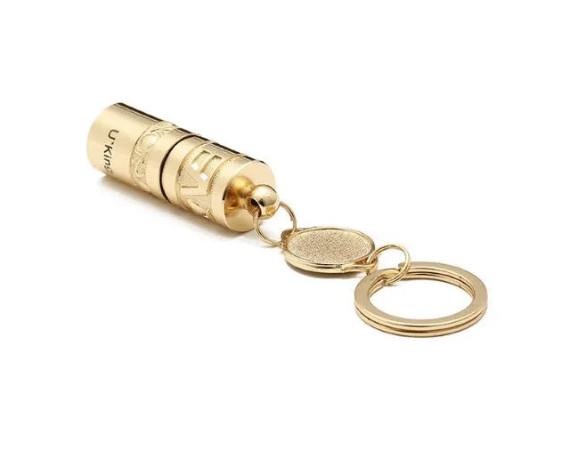 Gold-colour zinc alloy waterproof mini LED flashlight on a keychain ring.