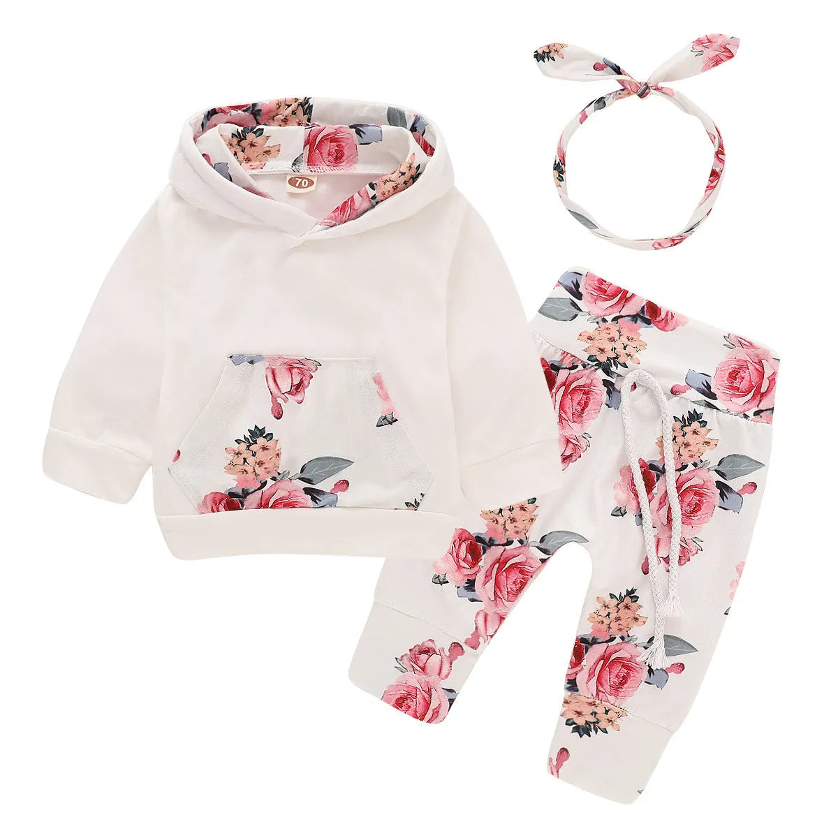 White cotton hooded romper suit for a baby girl with long sleeves and trouser legs.