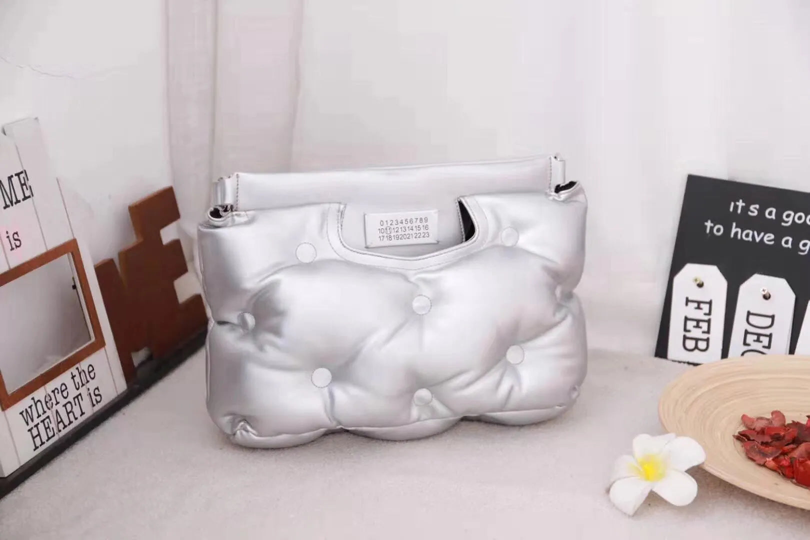 Large capacity black PU cotton down storage bag measuring 34cm x 11.5cm x 25cm on a neutral background