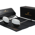 Classic round retro sunglasses for men with black frame and tinted lenses on a table.