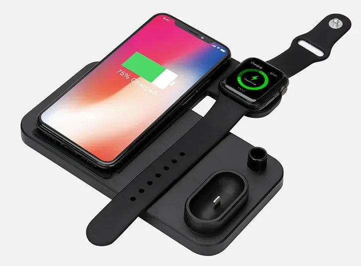 Black 4-in-1 wireless charging dock showing phone on adjustable stand, Apple Watch, AirPods, and Apple Pencil charging simultaneously.