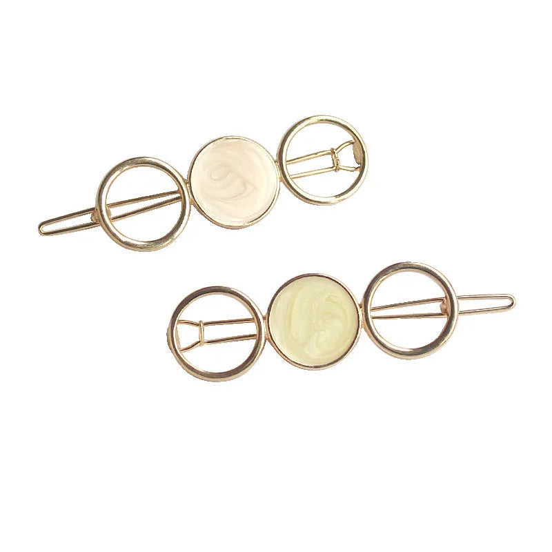Round metal hairpin with opal crystal centre in beige colour, 7cm alloy construction