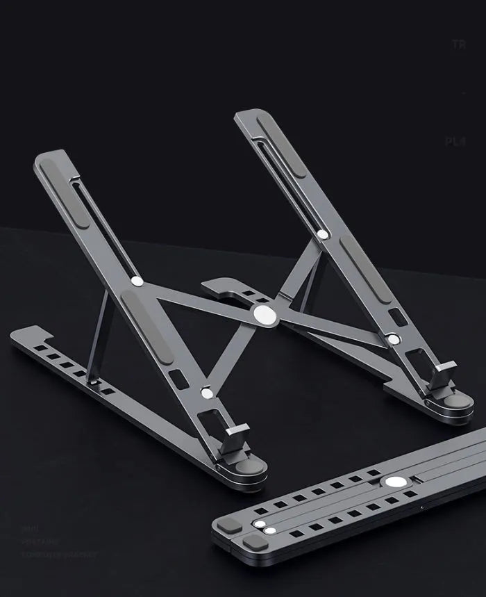 Aluminium foldable laptop stand in silver colour, shown open at an angle and folded flat.
