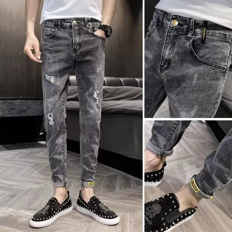 Men's classic high waist blue denim jeans with a button fly, shown laid flat.