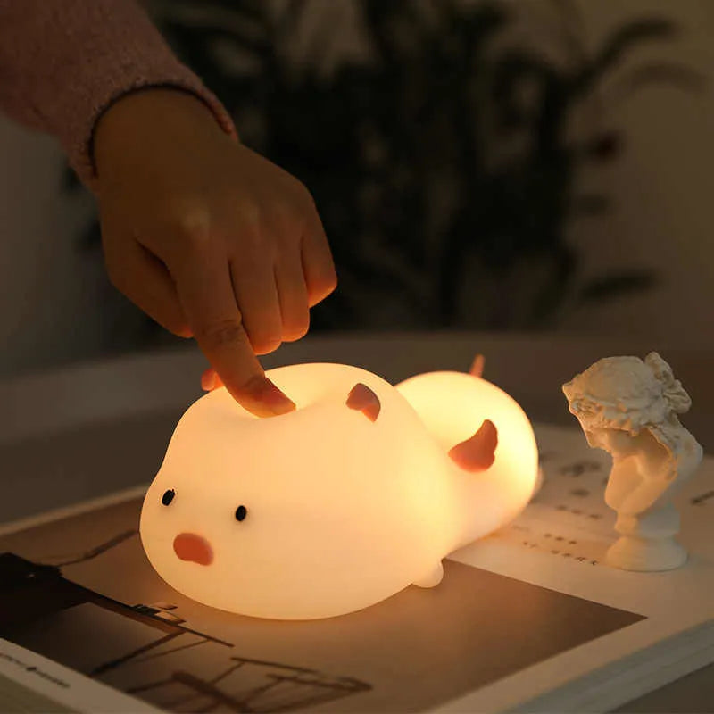 Blue silicone pig night light with sleeping expression and rechargeable battery