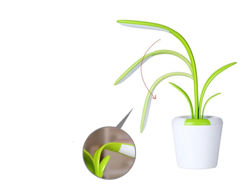 Modern rechargeable desk lamp with plant shape design in pink, showing touch control on a wooden end table