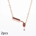 Wine bottle and cup pendant necklace with red enamel heart on gold chain