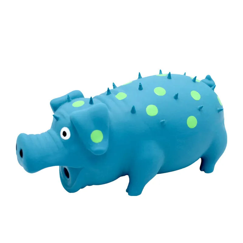 Blue latex pig-shaped dog chew toy with textured surface and squeaker on a wooden floor.