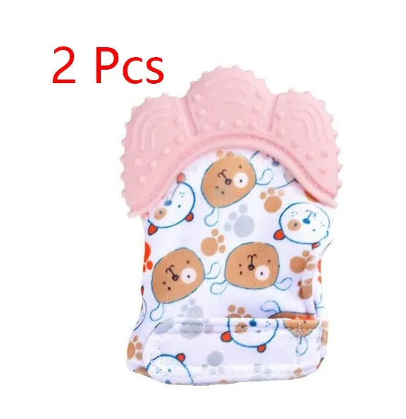 BPA-free silicone baby teether glove fastened with a white Velcro strap on a baby's hand