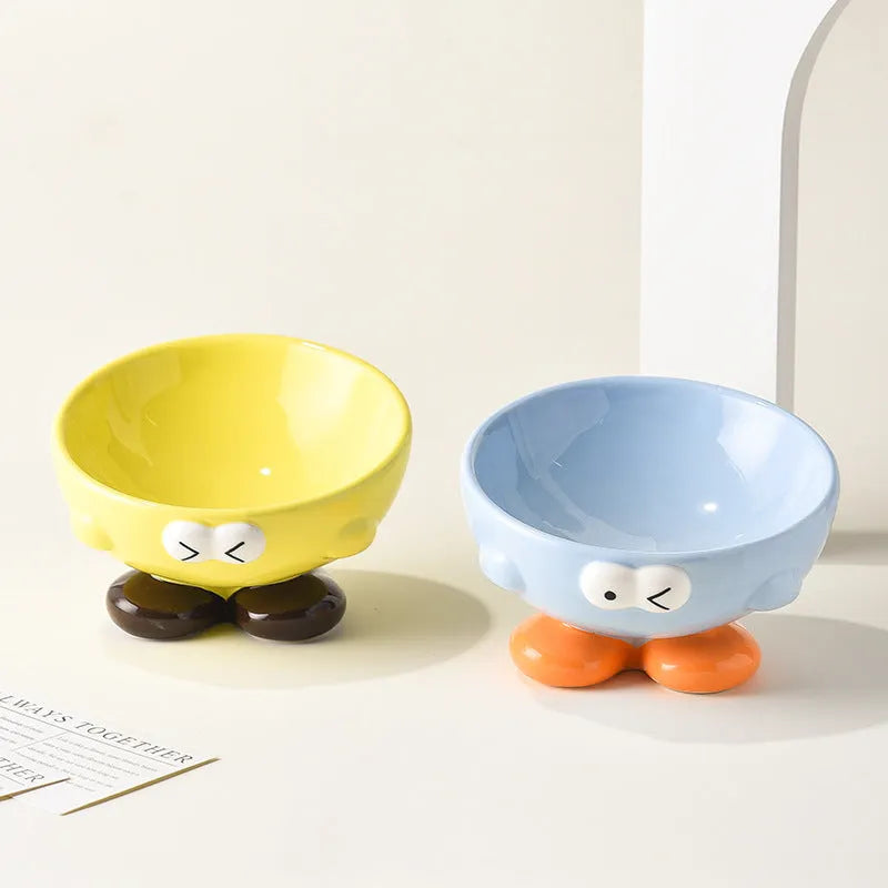 Cute Expression tall slanted ceramic pet food bowl in blue and yellow colours for cats and dogs