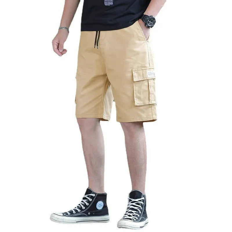 Man modelling loose fit khaki casual trousers with a giraffe pattern gradient detail.
