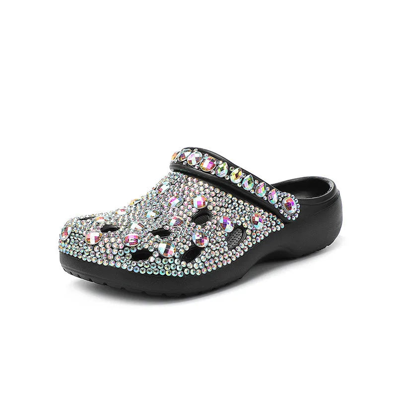 Black women's platform sandals with rhinestone detail on an EVA upper and a textured injection-moulded sole.