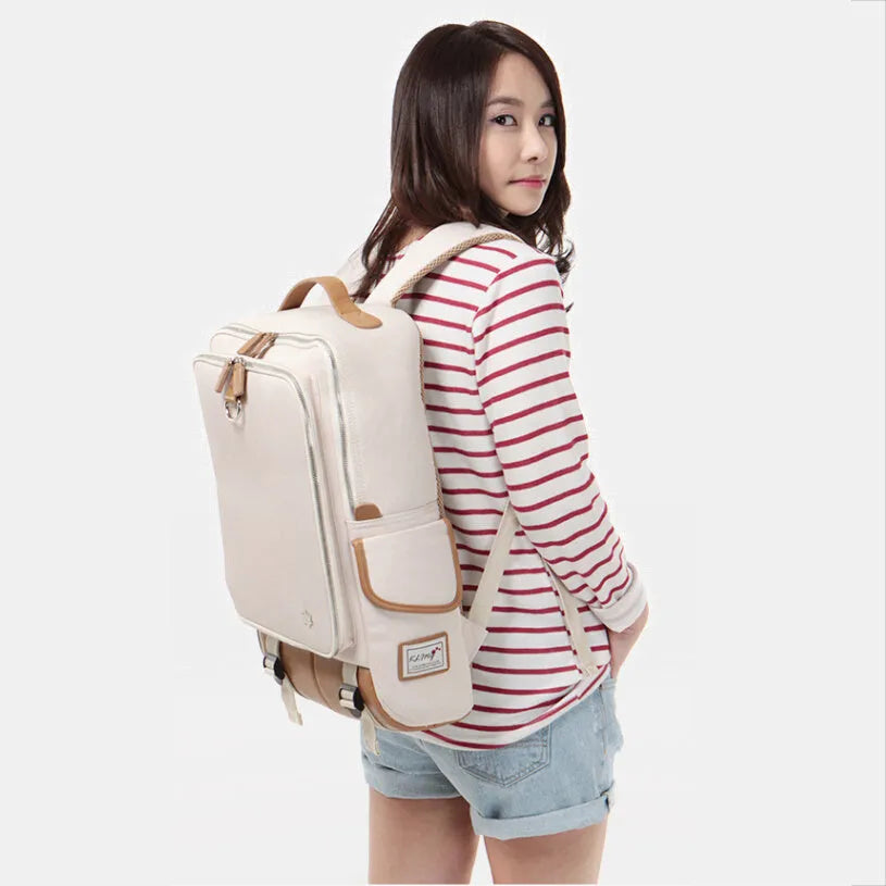 Men's modern Oxford fabric backpack in army green, showing front pockets and padded straps.