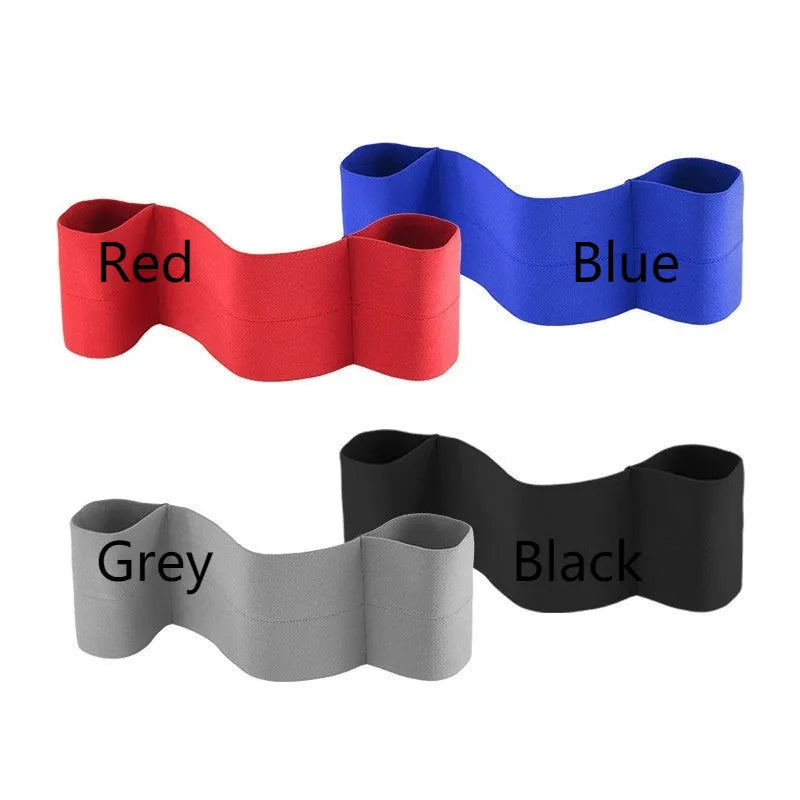 A black elastic elbow support bandage or compression sleeve worn on an arm.