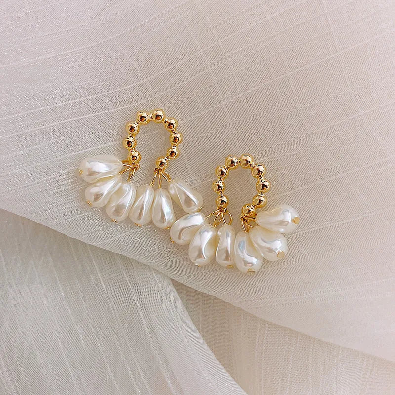 Female baroque pearl dangle drop earrings with silver or gold plated alloy finish and mosaic pearl colour