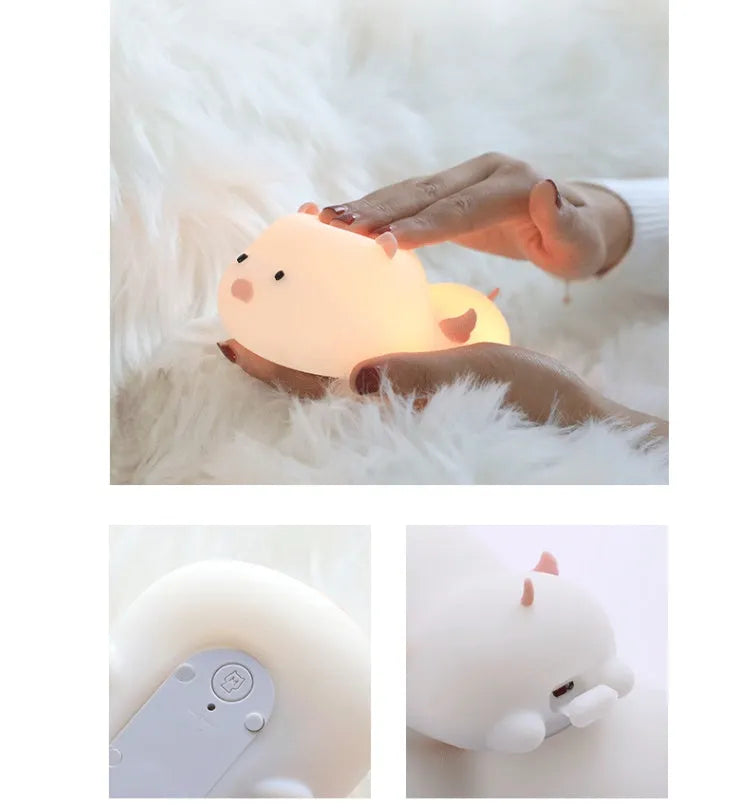 Blue silicone pig night light with sleeping expression and rechargeable battery