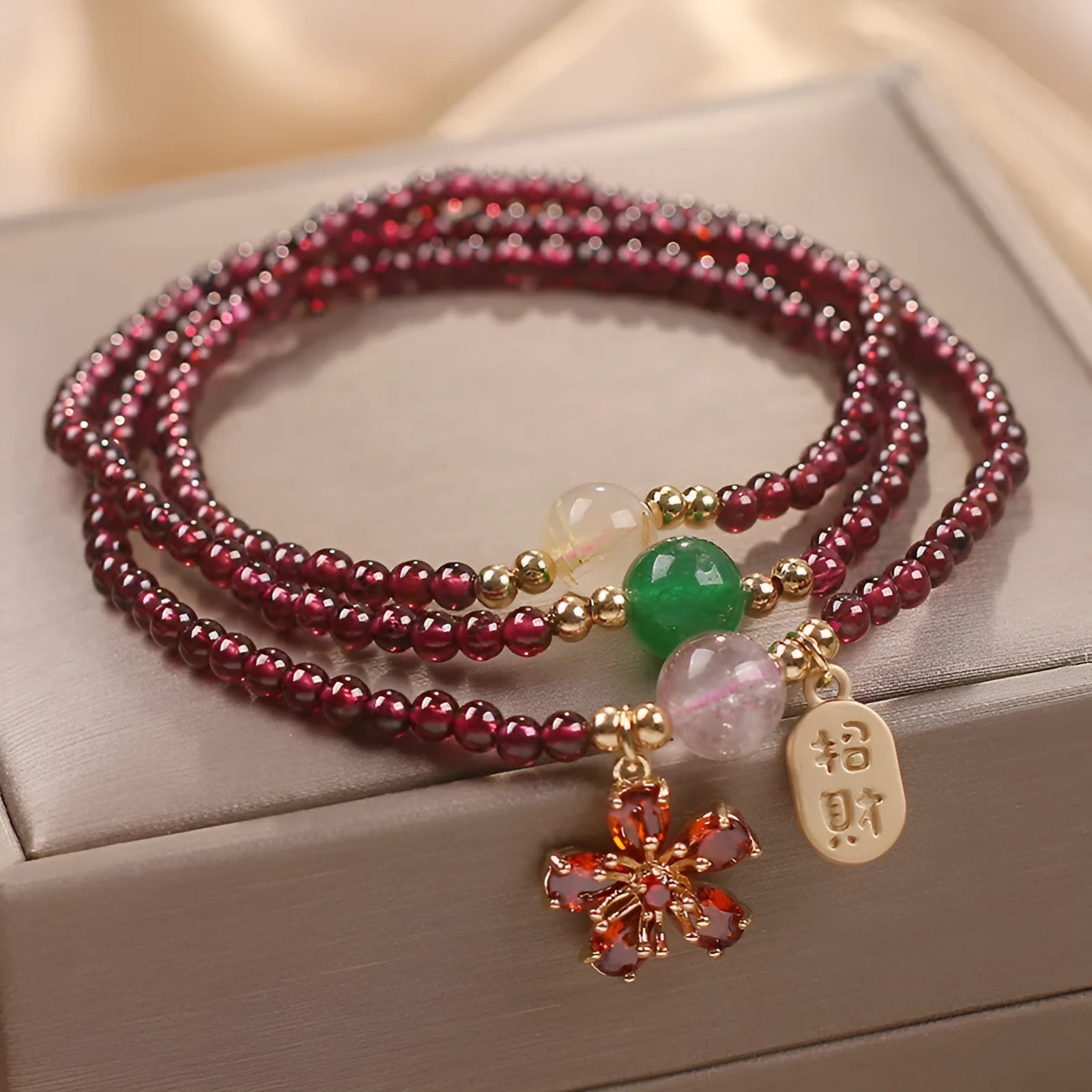 Women's natural crystal bracelet in pomegranate red cherry blossom colour with sequins detailing