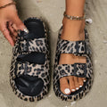 Women's thick sole EVA bathroom slippers in a leopard print design, showing non-slip patterned bottom.