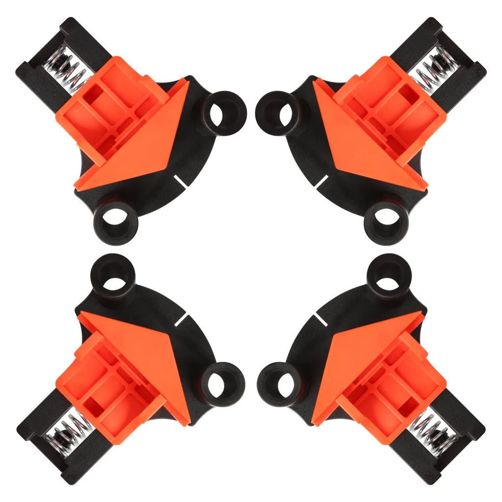 Four plastic 90-degree right-angle woodworking clamps for picture frame assembly.