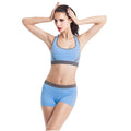 Women's shockproof seamless sports bra in black with fixed double shoulder straps and rear buckle
