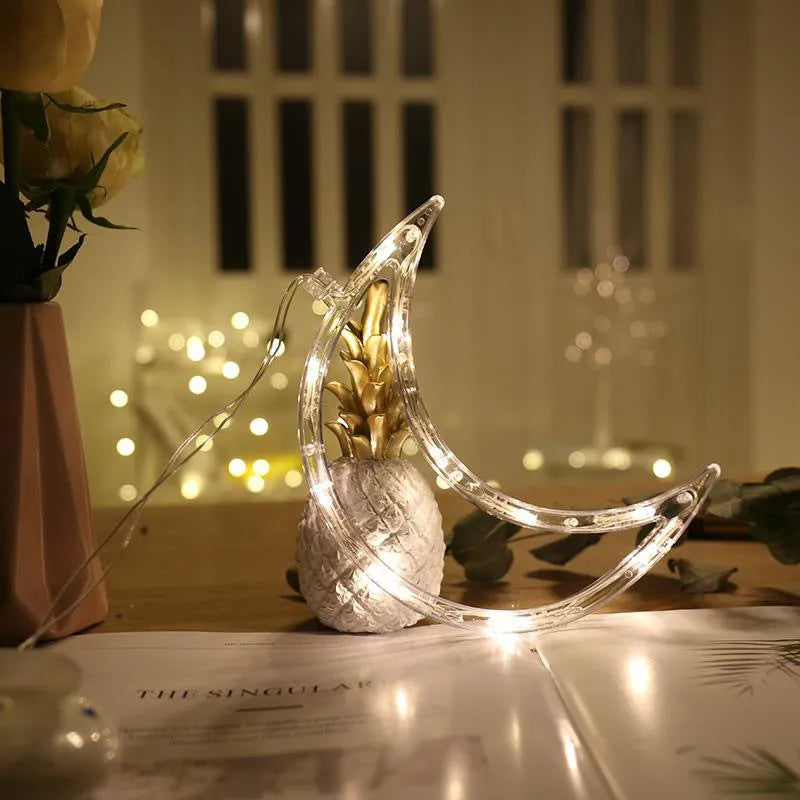 LED suction cup chandelier with Santa Claus, elk, and snowman shapes hanging on a window