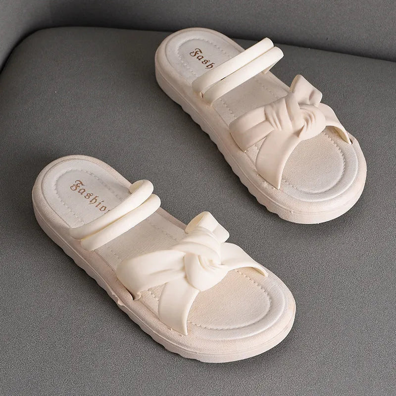 Women's black and white soft back outdoor sandals with flower detail and PVC sole