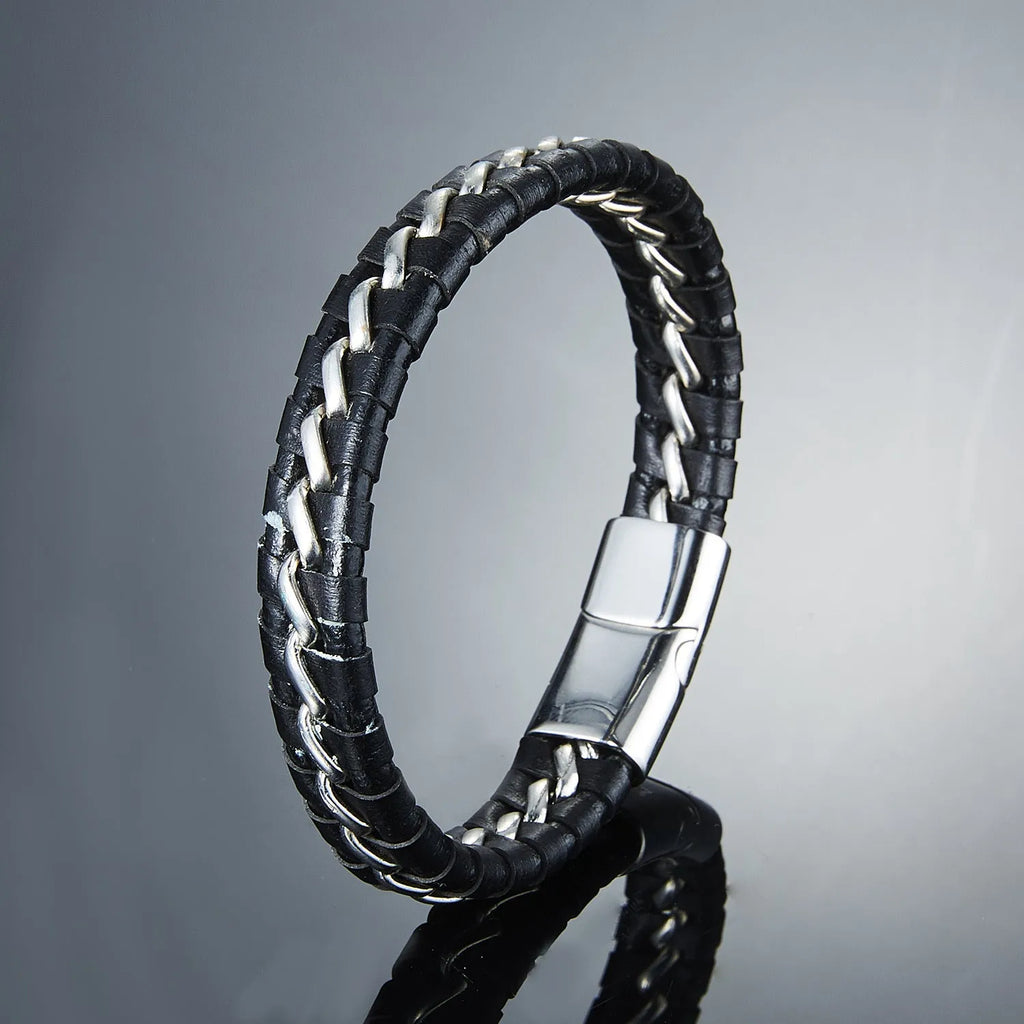 Woven leather bracelet for men with silver alloy cuff on a neutral background