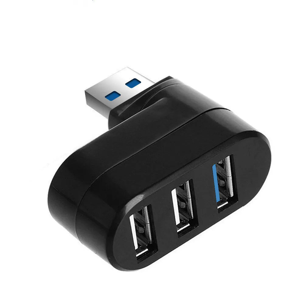 Black USB 3.0 four-port rotary hub on a desk next to a laptop, showing compact size.