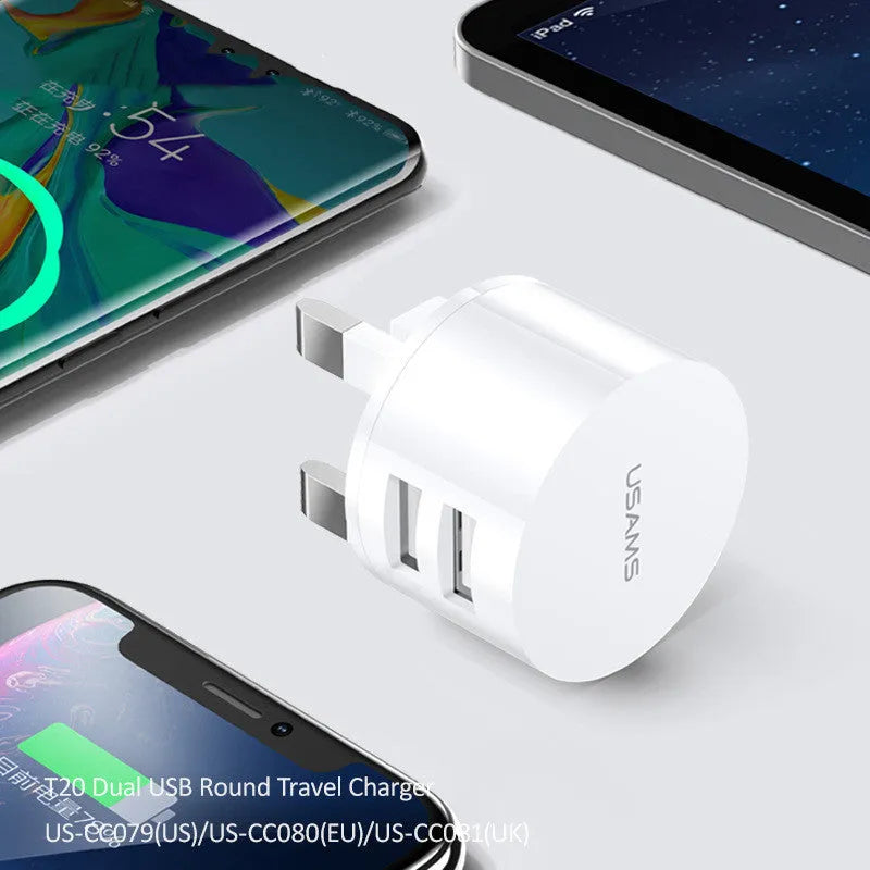 White portable universal dual USB phone charger with US EU UK plug compatibility and 39mm diameter