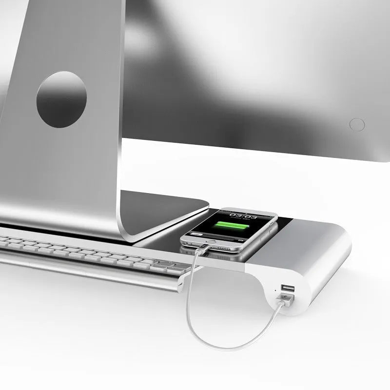Silver aluminium alloy notebook computer heighten base bracket with USB charging port on a desk