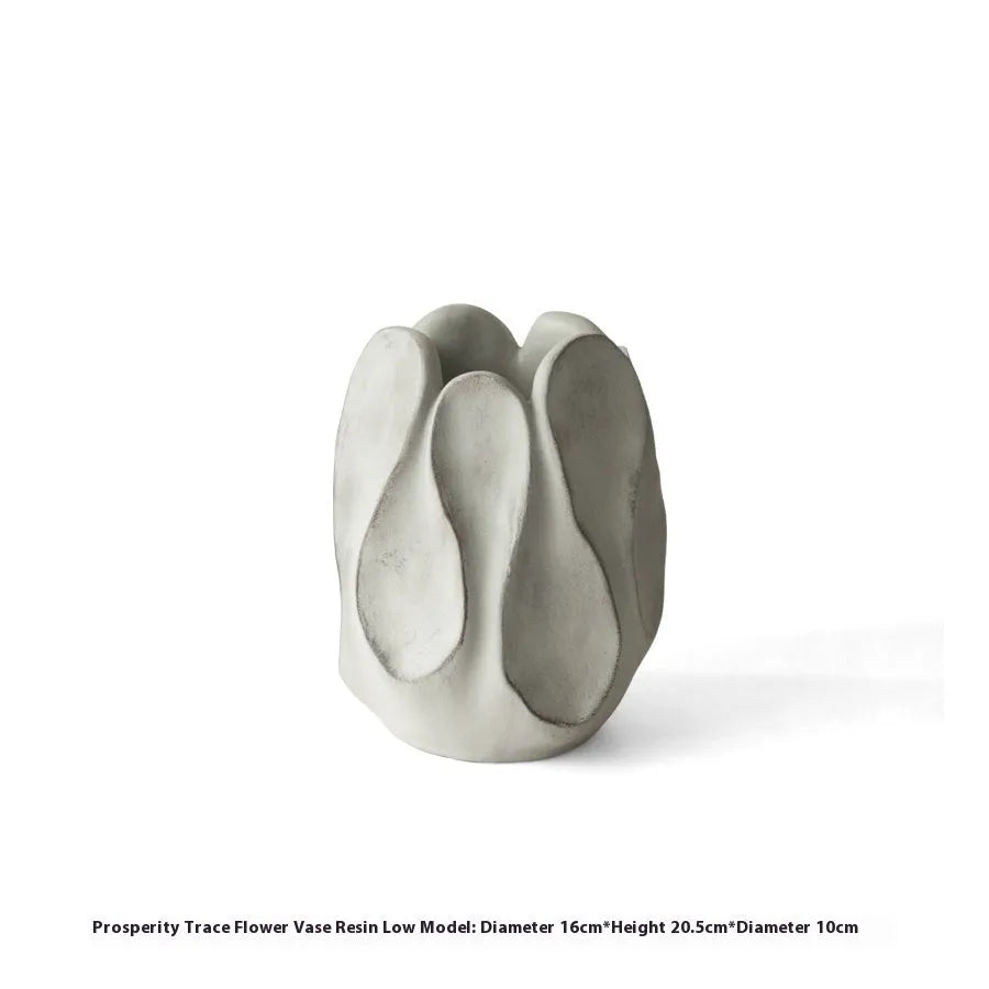 Irregular ceramic vase with resin flower device accents in magnesium clay material