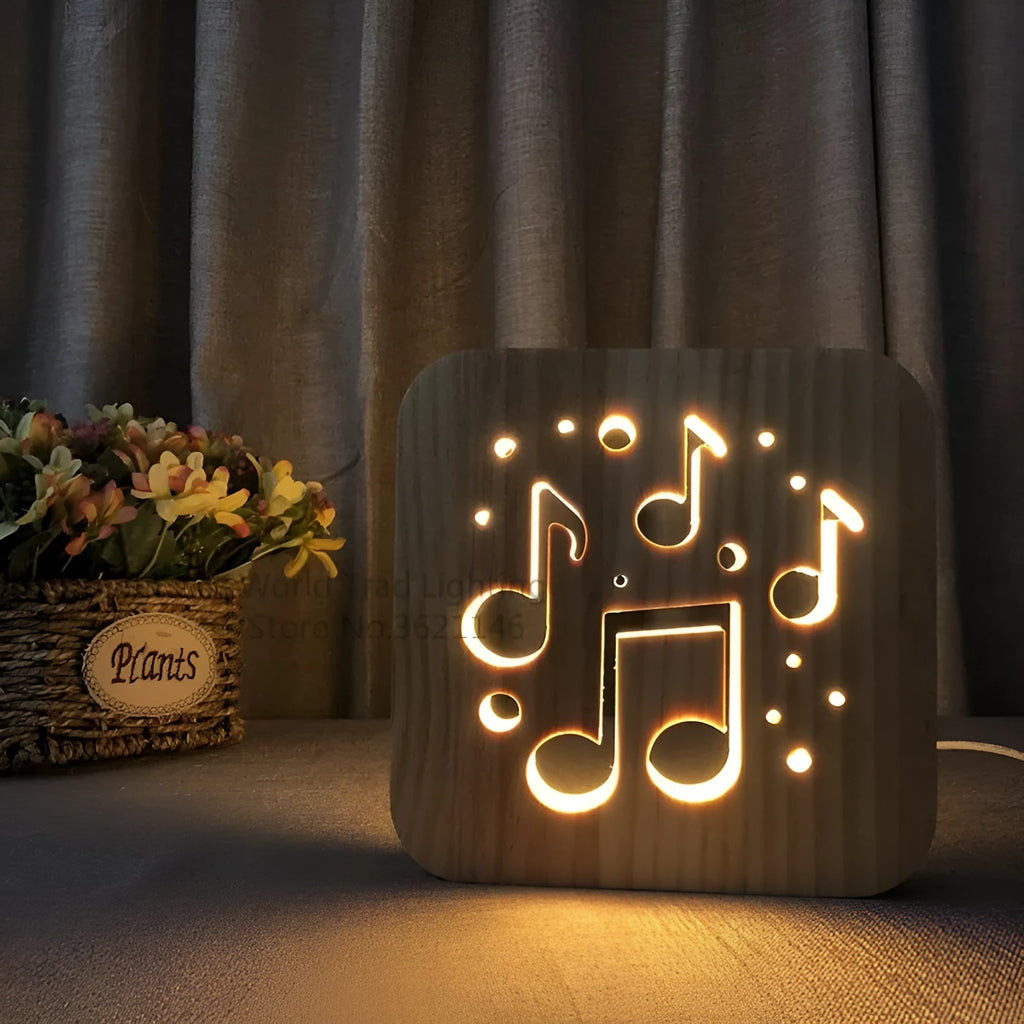 Wooden cube LED atmosphere lamp with warm white light on a desk, showing USB cable.
