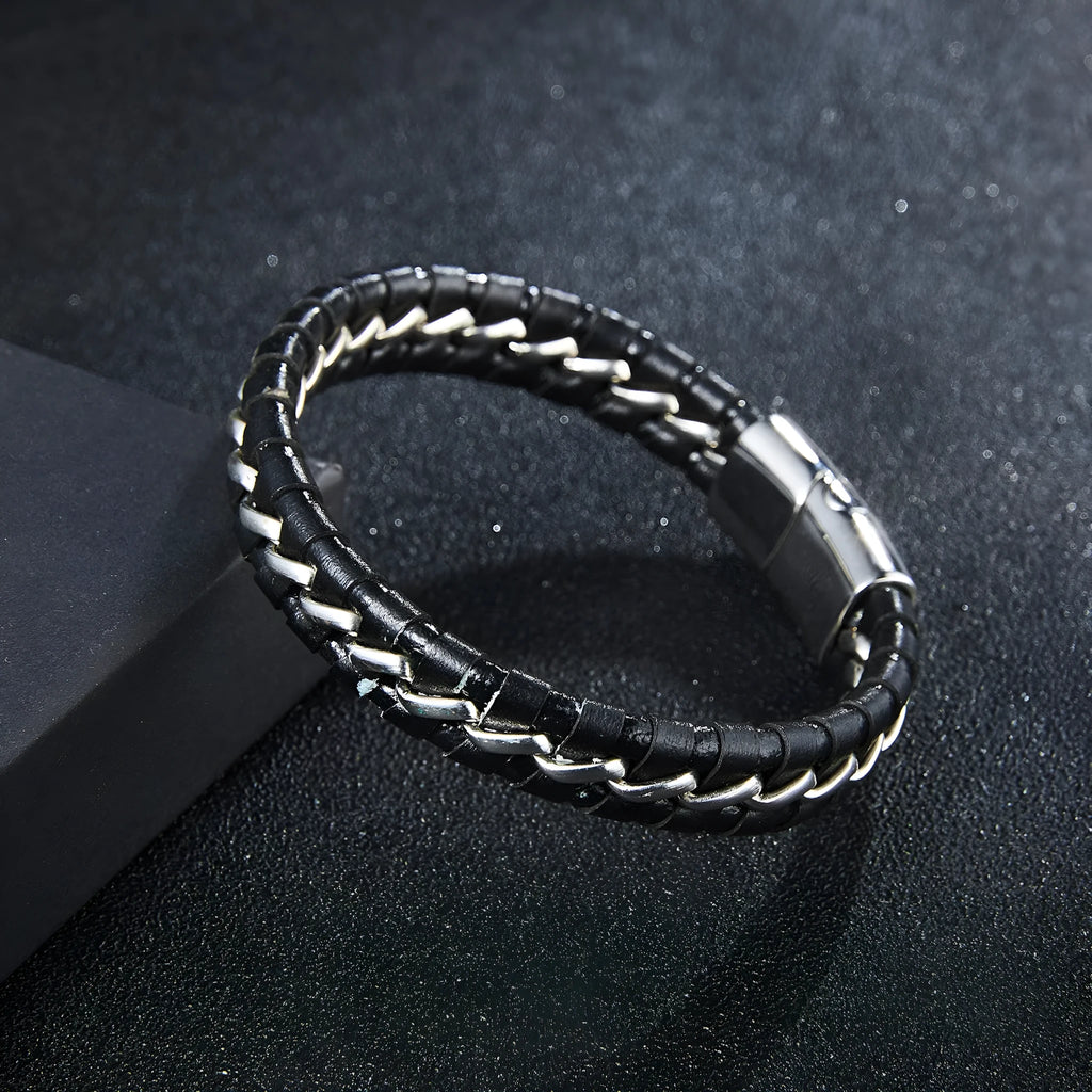 Woven leather bracelet for men with silver alloy cuff on a neutral background