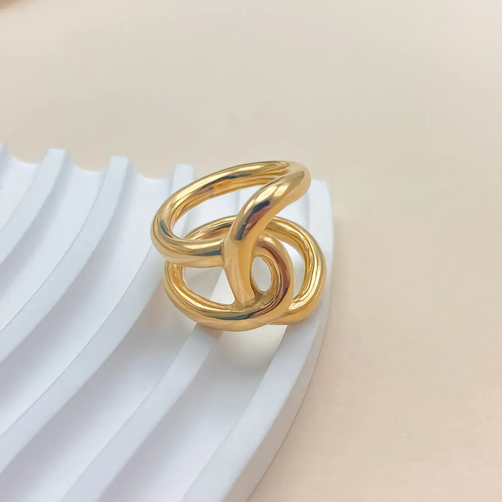 Women's adjustable stainless steel ring with geometric knot design on U-shaped opening