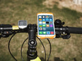 Black silicone bicycle phone holder mounted on handlebars showing three-hole adjustable bracket