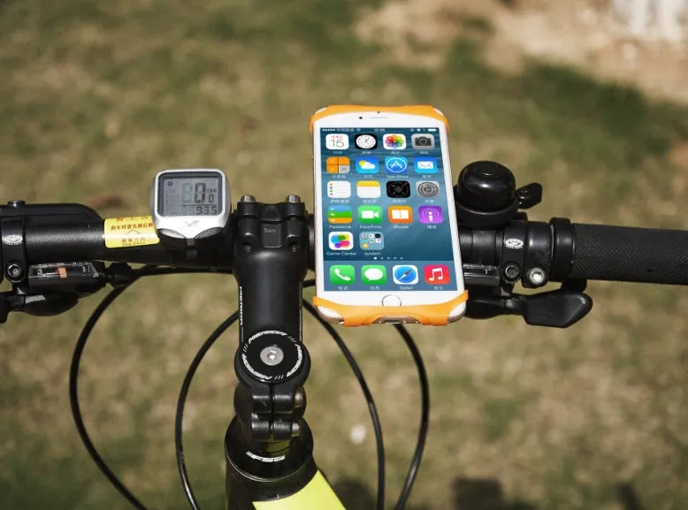 Black silicone bicycle phone holder mounted on handlebars showing three-hole adjustable bracket